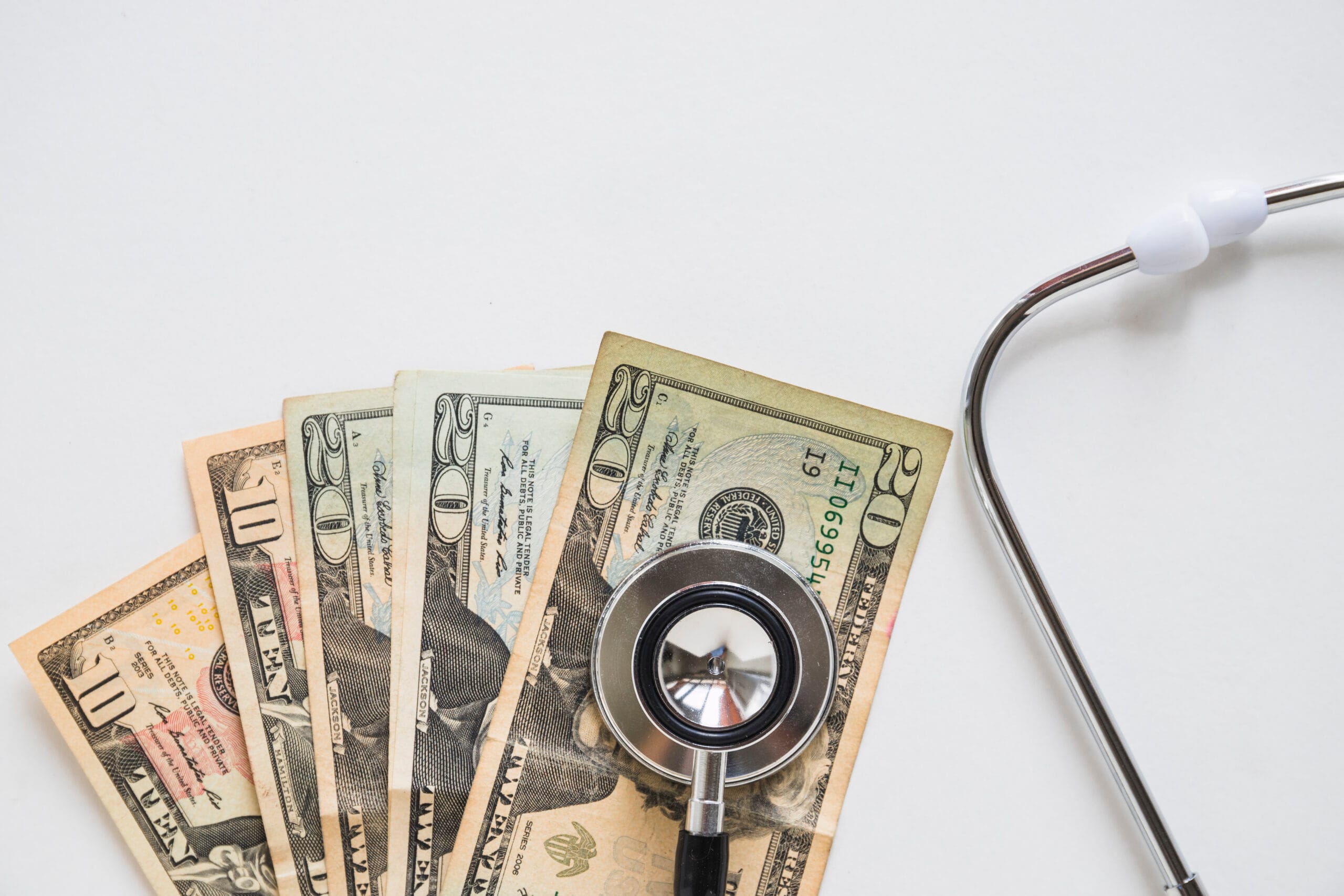 a cash & stethoscope to indicate medical loan